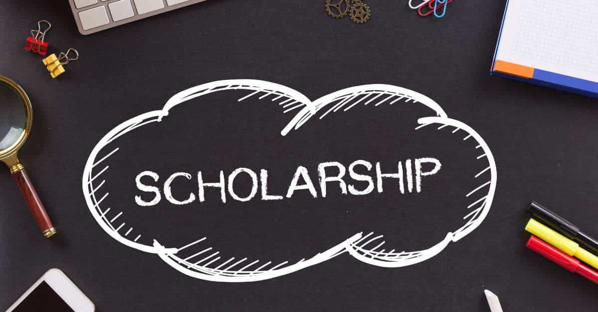 The word "scholarship" written on a blackboard