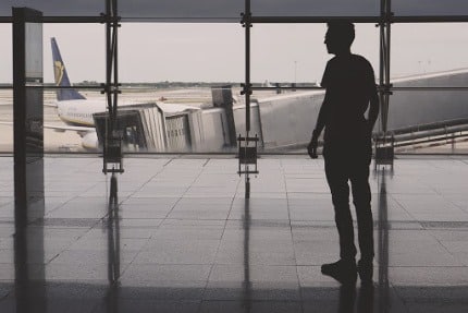man in airport separation anxiety