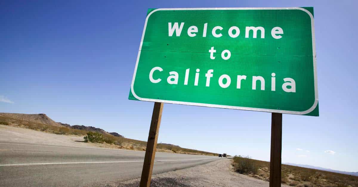 A green road sign that says, "Welcome to California"