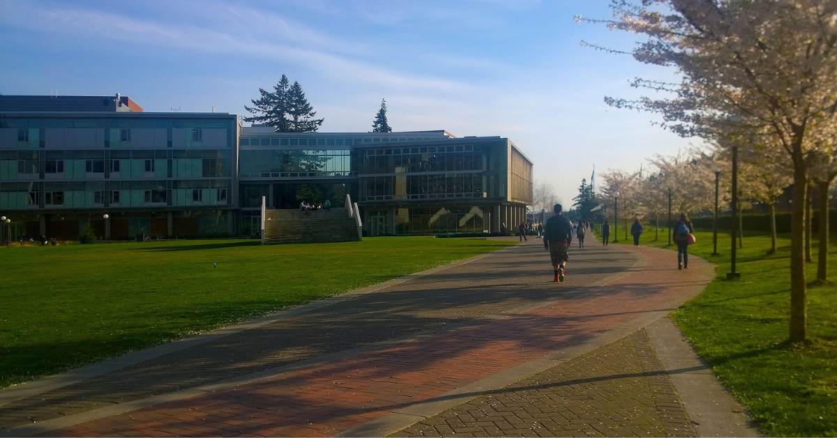 College Students Walking on Campus at Dusk