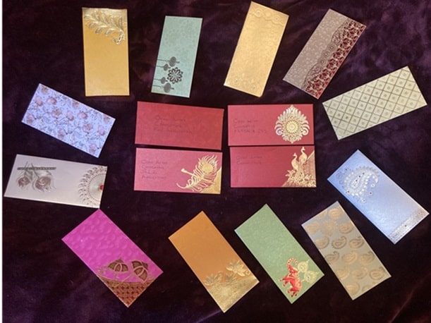Black background with colorful envelopes placed on top