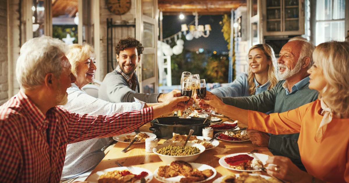 Parents, grandparents, and teens around a Thanksgiving table