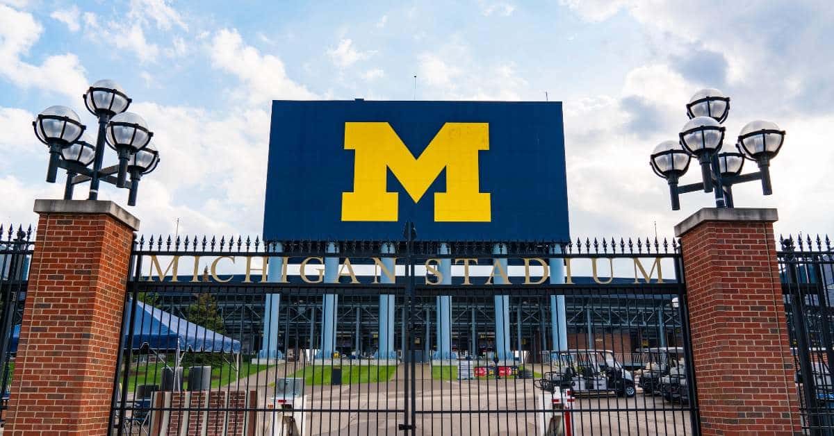 Large Blue banner with yellow M on it and "Michigan Stadium" written underneath.